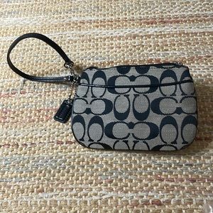 Coach wristlet with baby blue lining